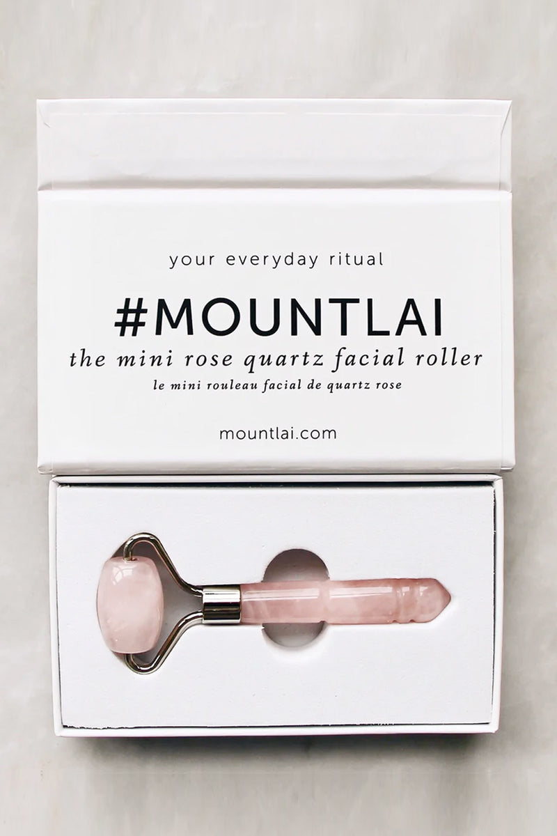 The Mini De-Puffing Rose Quartz Roller